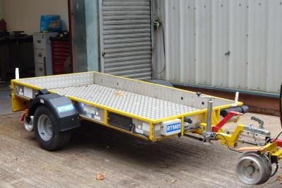 image showing a large yellow on-track machine
