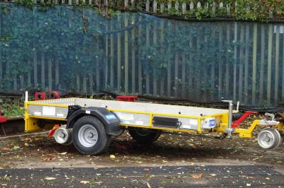 image showing a large yellow on-track machine
