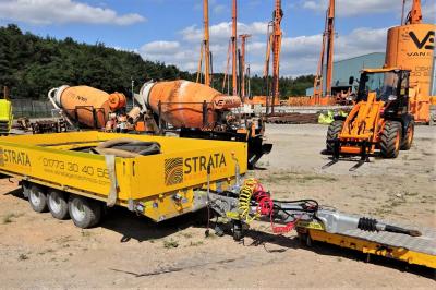 image showing a large yellow on-track machine