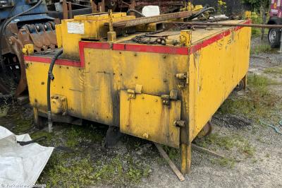 image showing a large yellow on-track machine