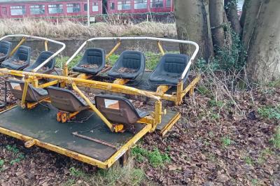 image showing a large yellow on-track machine