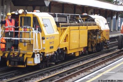 image showing a large yellow on-track machine
