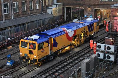 image showing a large yellow on-track machine
