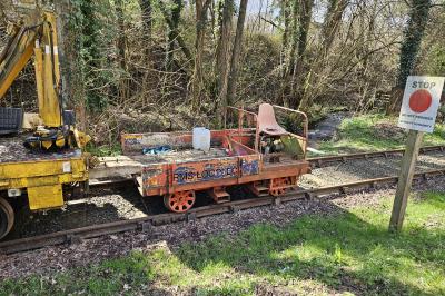 image showing a large yellow on-track machine
