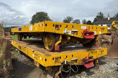image showing a large yellow on-track machine