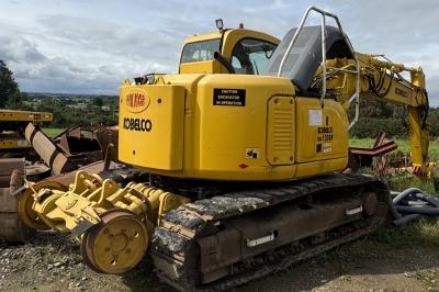 image showing a large yellow on-track machine
