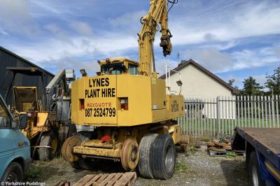 image showing a large yellow on-track machine