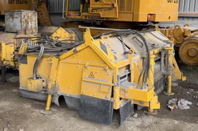 image showing a large yellow on-track machine