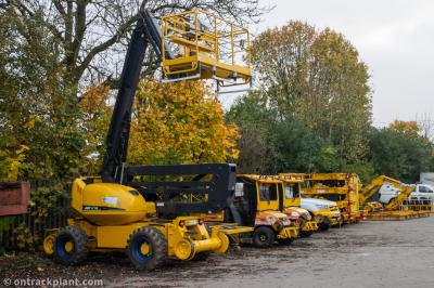 image showing a large yellow on-track machine