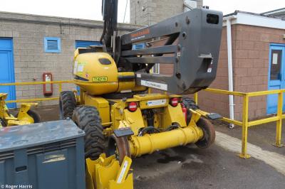 image showing a large yellow on-track machine
