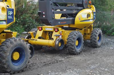 image showing a large yellow on-track machine