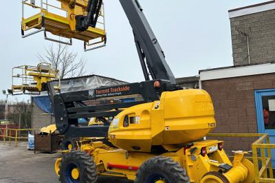 image showing a large yellow on-track machine