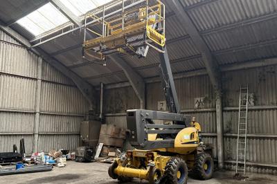 image showing a large yellow on-track machine