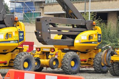 image showing a large yellow on-track machine