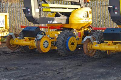 image showing a large yellow on-track machine