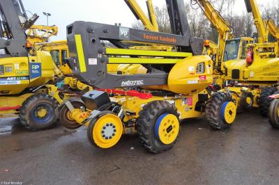 image showing a large yellow on-track machine