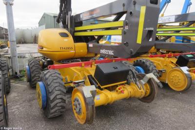 image showing a large yellow on-track machine