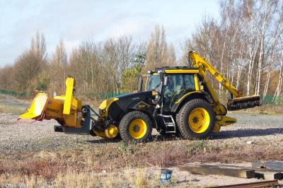 image showing a large yellow on-track machine