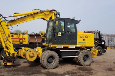 image showing a large yellow on-track machine