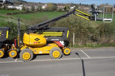 image showing a large yellow on-track machine