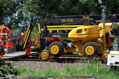 image showing a large yellow on-track machine