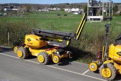 image showing a large yellow on-track machine