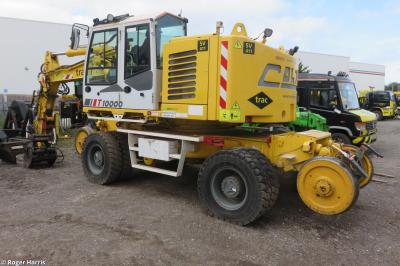 image showing a large yellow on-track machine
