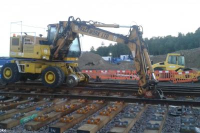 image showing a large yellow on-track machine