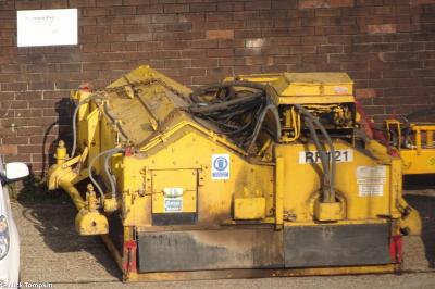 image showing a large yellow on-track machine