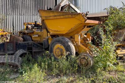 image showing a large yellow on-track machine