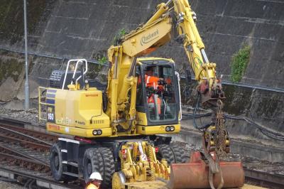 image showing a large yellow on-track machine
