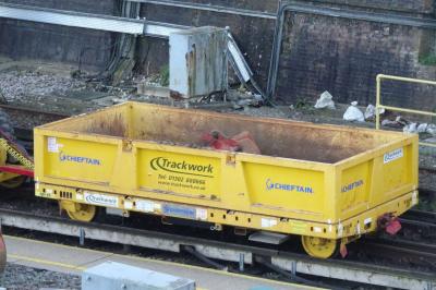 image showing a large yellow on-track machine