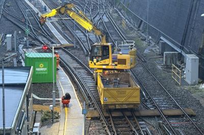 image showing a large yellow on-track machine