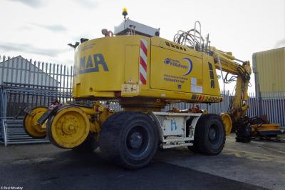image showing a large yellow on-track machine