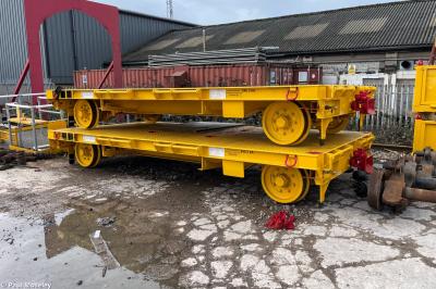 image showing a large yellow on-track machine