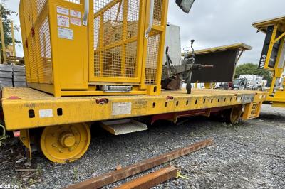 image showing a large yellow on-track machine
