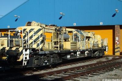 image showing a large yellow on-track machine