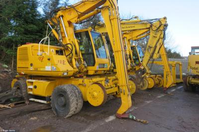 image showing a large yellow on-track machine