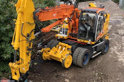 image showing a large yellow on-track machine