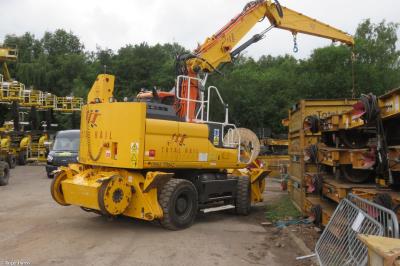 image showing a large yellow on-track machine