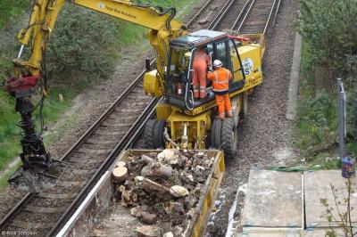 image showing a large yellow on-track machine