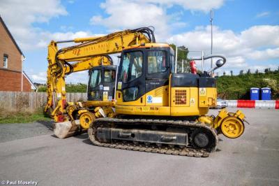 image showing a large yellow on-track machine