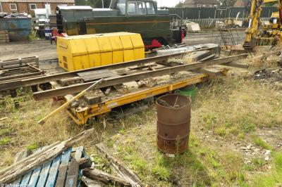 image showing a large yellow on-track machine