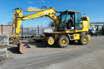 image showing a large yellow on-track machine