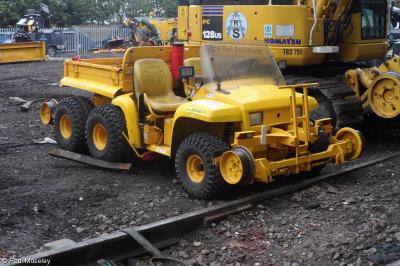 image showing a large yellow on-track machine