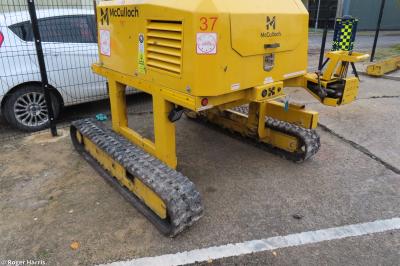 image showing a large yellow on-track machine
