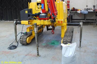 image showing a large yellow on-track machine