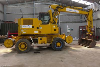 image showing a large yellow on-track machine
