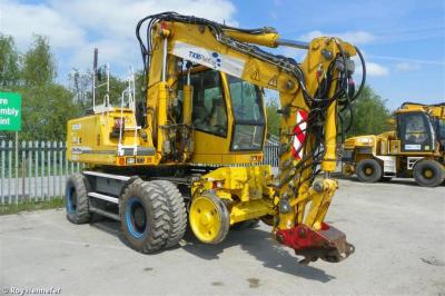 image showing a large yellow on-track machine
