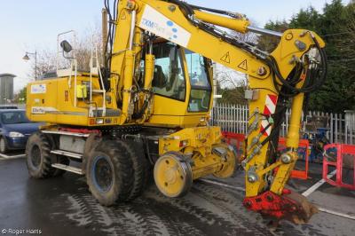 image showing a large yellow on-track machine